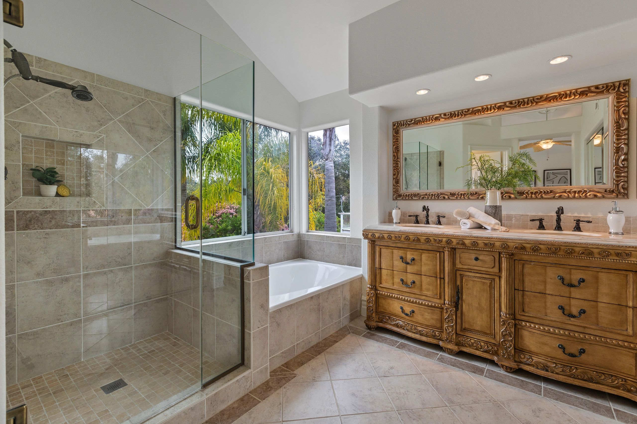 Primary bathroom with double-sink vanity and walk-in shower