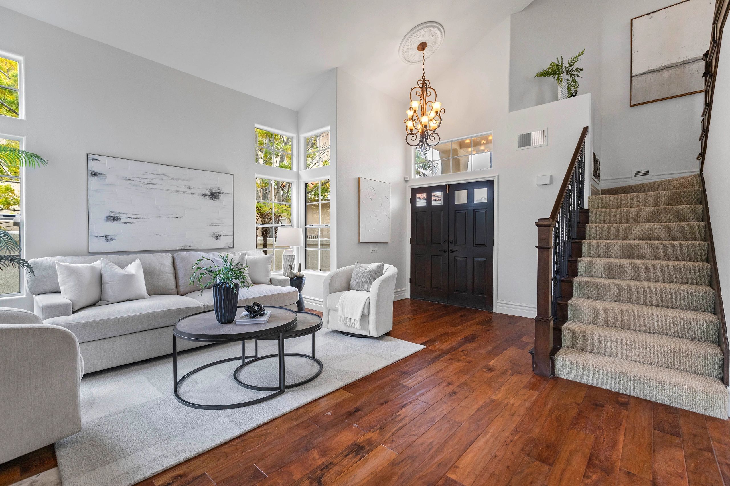 Living room with hardwood floors and staircase